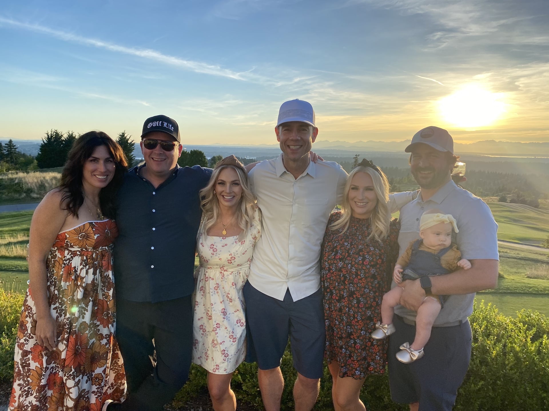 Southwestern Speaker Ron Alford poses with his family with trees, hills and blue sky in the background